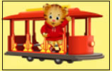 A cartoon tiger wearing a red hoodie waves while riding on a red trolley car against a yellow background.